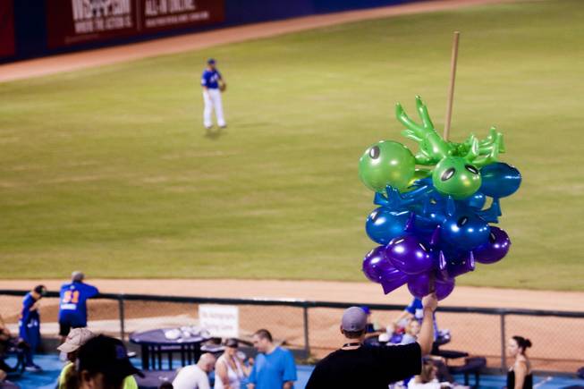 A vendor sells 51s alien mascot inflatables during their game against Tuscon, Saturday, Aug. 31, 2013. The 51s won the Pacific Coast League Southern Division title beating Tuscan 8-6.