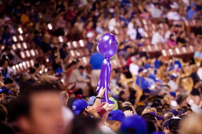 A fan holds up an inflated purple alien during the 51s game against Tuscon, Saturday, Aug. 31, 2013. The 51s won the Pacific Coast League Southern Division title beating Tuscan 8-6.