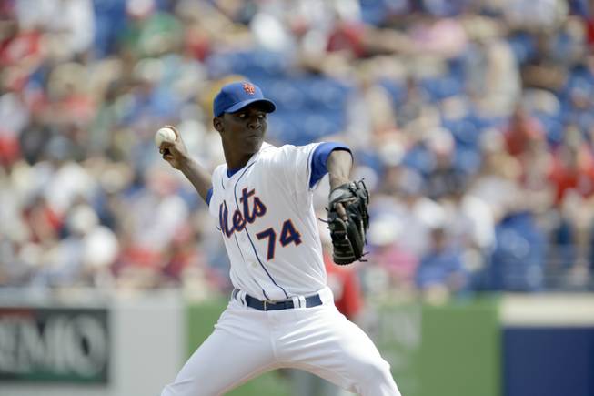 New York Mets starting pitcher Rafael Montero throws during the first inning of an exhibition spring training baseball game against the Washington Nationals Saturday, March 23, 2013, in Port St. Lucie, Fla.