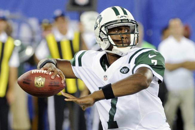 New York Jets quarterback Geno Smith looks for a receiver during the second half of a preseason NFL football game against the New York Giants Saturday, Aug. 24, 2013, in East Rutherford N.J. 