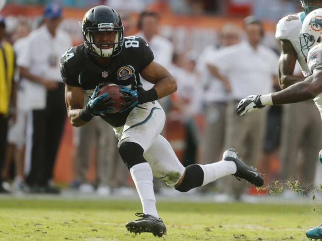 Jacksonville Jaguars wide receiver Cecil Shorts (84) runs with the ball during the second half of an NFL football game against the Miami Dolphins, Sunday, Dec. 16, 2012, in Miami. 