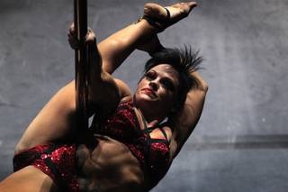 Amber Cahill performs during the Pole Classic at Rain Nightclub inside the Palms in Las Vegas on Friday, September 6, 2013.