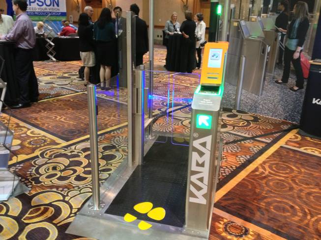Kaba, an access and data systems technology company based in Ben Wheeler, Texas, showed its multipurpose check-in gateway that automates the aircraft boarding process, shown at the Future Travel Experience Global trade show on Sept. 5, 2013.