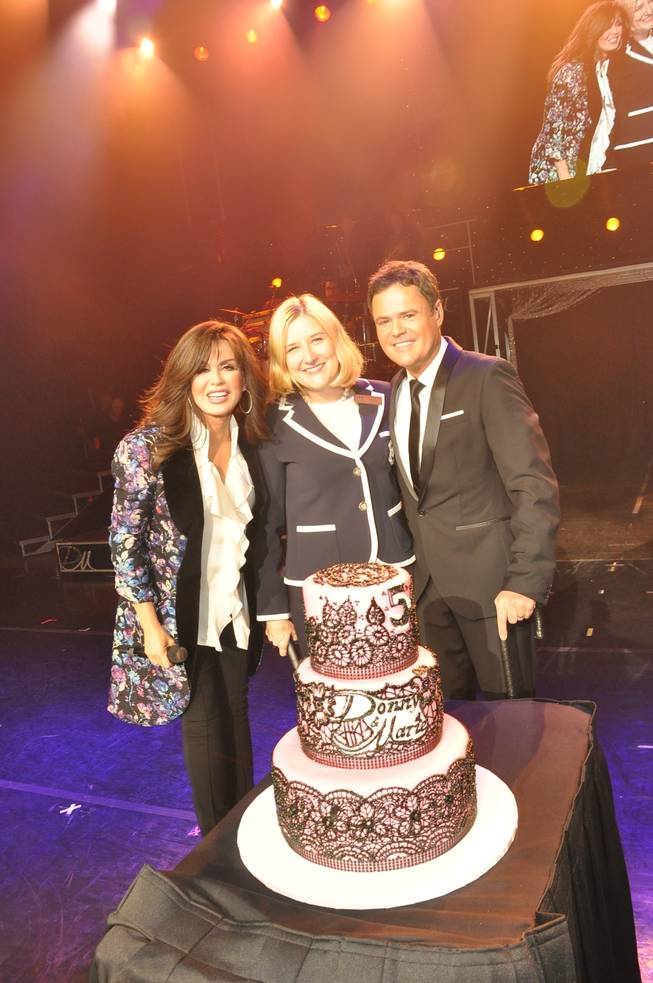 Marie Osmond, Flamingo Las Vegas Regional President Eileen Moore and Donny Osmond onstage in the Flamingo Showroom on Tuesday, Sept. 10, 2013, to celebrate the brother and sister's resident headliner show's fifth anniversary.