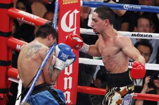 Danny Garcia sends Lucas Matthysses into the ropes during their fight Saturday, Sept. 14, 2013 at the MGM Grand Garden Arena.