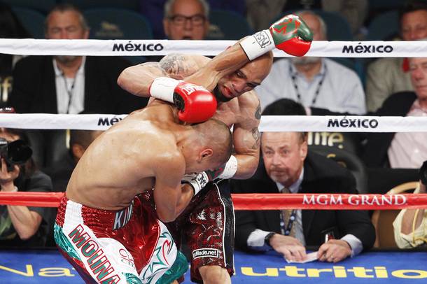 Carlos Molina and Ishe Smith trade punches during their fight Saturday, Sept. 14, 2013 at the MGM Grand Garden Arena.