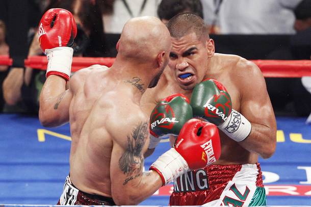 Carlos Molina closes in on Ishe Smith during their fight Saturday, Sept. 14, 2013 at the MGM Grand Garden Arena.