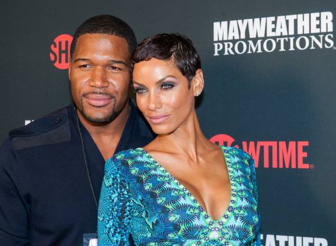 Michael Strahan and his fiancee Nicole Murphy arrive at the ...