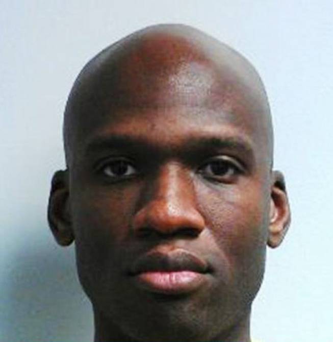 This handout photo provided by the FBI shows Aaron Alexis. Alexis launched an attacked Monday morning inside a building at the Washington Navy Yard, spraying gunfire on office workers in the cafeteria and in the hallways authorities said. At least 13 people were killed, including Alexis.