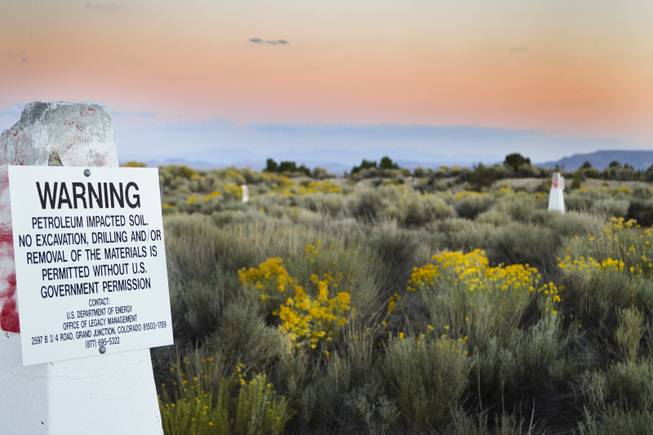 A site near the ghost town of Moores Station in Nye County has more than a dozen Energy Department signs, posted on concrete pillars, warning people not to dig or remove dirt. In the 1960s, the federal government planned to test a nuclear weapon here but never did. The photo was taken Sept. 16, 2013.