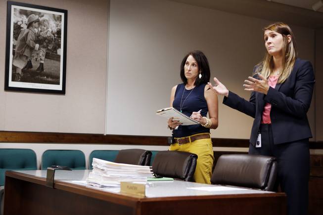 Kisha Earhart, left, a senior family services specialist with the five-and-under team, appears in Family Court with district attorney Kristen Kramer in Las Vegas on Tuesday, Sept. 17, 2013.