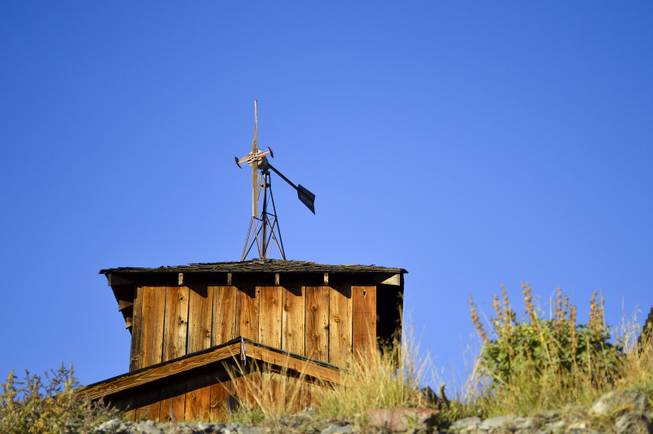 A weather vane stands atop a building in Belmont, Nev., on Sept. 17, 2013.