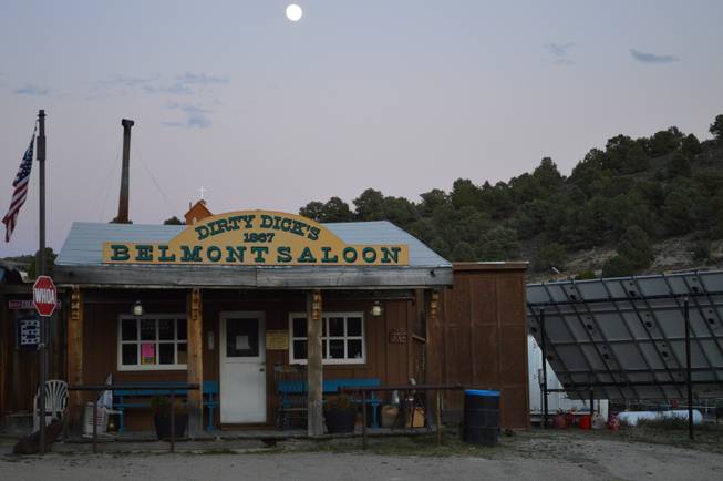 The moon rises over Dirty Dick's Saloon in Belmont and the Belmont church on Tuesday, Sept. 17, 2013.
