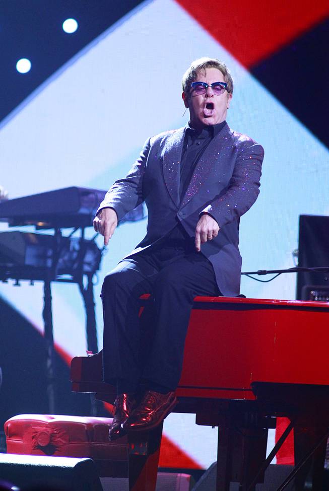 Elton John performs during the iHeartRadio Music Festival at the MGM Grand Garden Arena Friday, Sept. 20, 2013.
