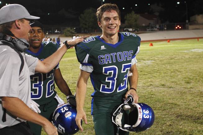 Green Valley kicker Conor Perkins is congratulated after their win over Palo Verde Friday, Sept. 20, 2013. Green Valley won the game in overtime 42-41.
