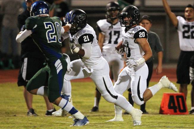 Palo Verde fullback Sean Dennis gets a block from linebacker Jaren Campbell during their game Friday, Sept. 20, 2013. Green Valley won the game in overtime 42-41.