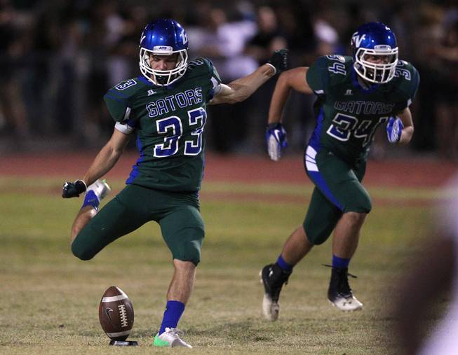 Green Valley kicker Conor Perkins sends off a kick to Palo Verde during their game Friday, Sept. 20, 2013. Green Valley won the game in overtime 42-41.
