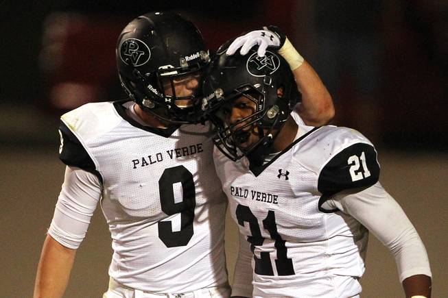 Palo Verde running back Jaren Campbell is congratulated by teammate Jake Ortale after scoring a touchdown against Green Valley during their game Friday, Sept. 20, 2013. Green Valley won the game in overtime 42-41.