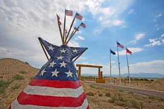 This July 26, 2013, photo shows the stars and stripes art work that greets visitors at the Mustang Monument Wild Horse Eco Resort in Wells, Nev. The resort has a herd of about 700 free-roaming horses, and aims to be an engine for the nonprofit organization Saving America's Mustangs.