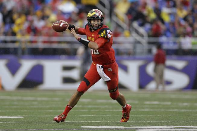 Maryland quarterback C.J. Brown looks for a receiver in the first half of an NCAA college football game against West Virginia in Baltimore, Saturday, Sept. 21, 2013.