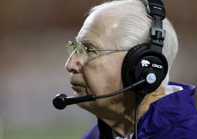 Kansas State coach Bill Snyder watches his team during the first half of an NCAA college football game against Texas, Saturday,  Sept. 21, 2013, in Austin, Texas. 