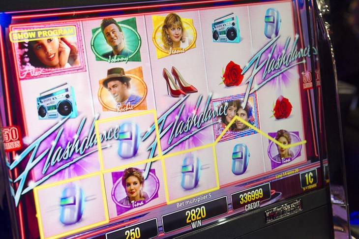 A screen from a Flashdance video slot machine by Aristocrat is shown during the G2E convention at the Sands Expo Center Tuesday, Sept. 24, 2013.