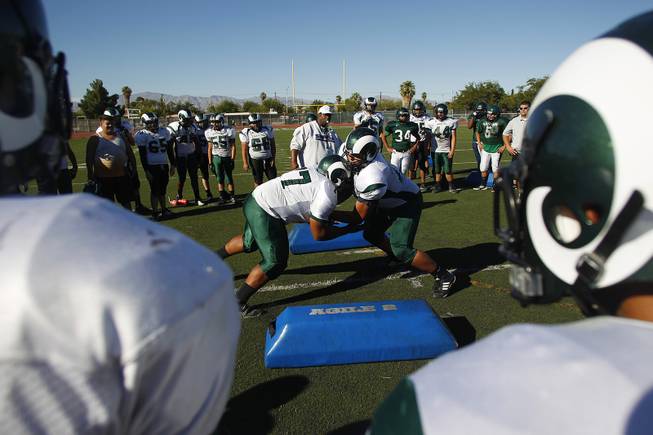 Rancho football players take part in a drill during practice Tuesday, Sept. 24, 2013.
