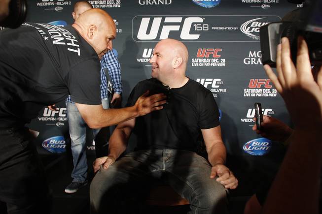 Dana White takes questions during a news conference to promote UFC 168 Tuesday, Sept. 24, 2013.