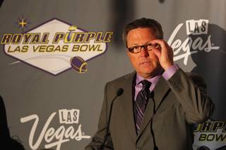 Executive Director of the Royal Purple Las Vegas Bowl Dan Hanneke speaks during the kickoff luncheon for the annual bowl game Wednesday, Sept. 25, 2013. Royal Purple, a manufacturer of motor oil and other lubricants, was announced as the new title sponsor of the game for the next three years.