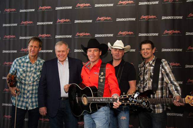 Clay Walker, center, and his band at the 2013 Barrett-Jackson ...