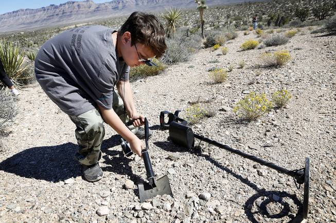Jacob Kessler, 10, digs in a spot during a metal detector treasure hunt at a Gold Searchers of Southern Nevada outing at a claim near Meadview, Ariz. on Saturday, September 28, 2013.