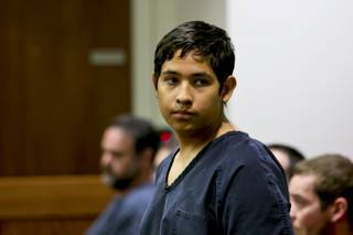 Adrian Navarro-Canales, the 16-year-old accused of killing his mom and brother, appears before Judge Gibson at the Henderson Justice Court, Monday Sept. 30, 2013.