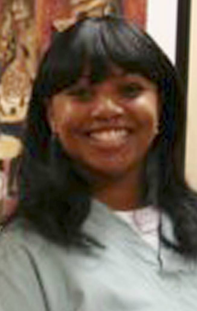 This 2011 photo provided by Dr. Barry Weiss, from the website of Advanced Periodontics in Hamden, Conn., shows former employee Miriam Carey. The 34-year-old Carey was shot to death by police after a car chase that began when she tried to breach a barrier at the White House.