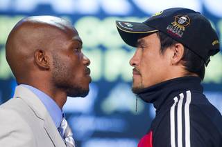Undefeated WBO welterweight champion Timothy Bradley Jr., left, and Juan Manuel Marquez face off during a news conference at the Wynn on Wednesday, Oct. 9, 2013. Bradley will defend his title against Marquez on Saturday at the Thomas & Mack Center.