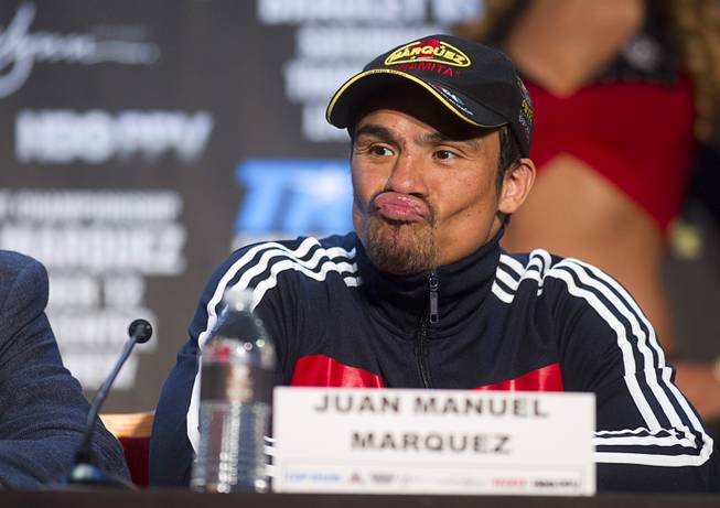 Mexican boxer Juan Manuel Marquez makes a face during a news conference at the Wynn Las Vegas Resort Wednesday, Oct. 9, 2013. Marquez will challenge undefeated WBO welterweight champion Timothy Bradley Jr.  for the title at the Thomas & Mack Center Saturday.