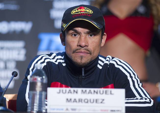 Mexican boxer Juan Manuel Marquez attends a news conference at the Wynn Las Vegas Resort Wednesday, Oct. 9, 2013. Marquez will challenge undefeated WBO welterweight champion Timothy Bradley Jr.  for the title at the Thomas & Mack Center Saturday.
