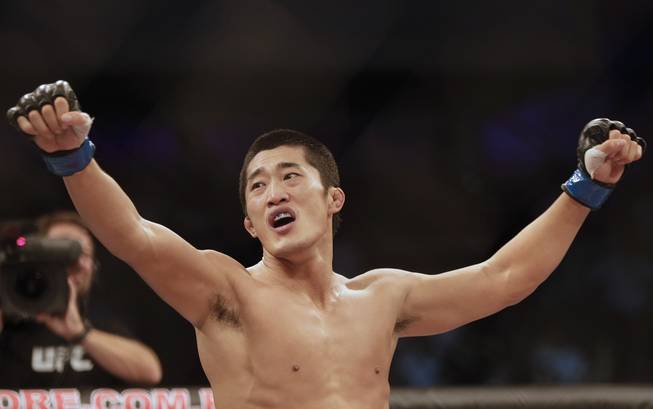 Dong Hyun Kim, from South Korea, celebrates after defeating Erick Silva, from Brazil, during their Welterweight mixed martial arts bout at the Ultimate Fighting Championship (UFC) in Barueri, on the outskirt of Sao Paulo, Brazil, Wednesday, Oct. 9, 2013.
