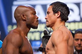 Undefeated WBO welterweight champion Timothy Bradley Jr., left, and Juan Manuel Marquez of Mexico face off during an official weigh-in at the Wynn Las Vegas Friday, Oct. 11, 2013. Bradley will defend his title against Marquez at the Thomas & Mack Center on Saturday.