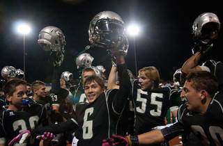 Green Valley Gator players celebrate after defeating visiting Las Vegas High in their homecoming game 39-38.