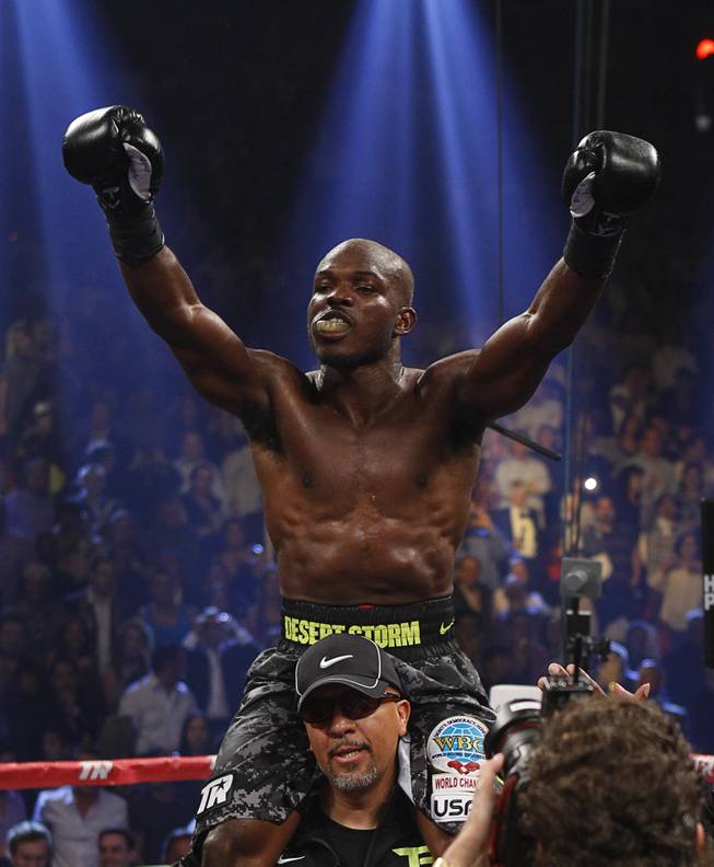 Undefeated WBO welterweight champion Timothy Bradley Jr. celebrates his victory over Juan Manuel Marquez of Mexico at the Thomas & Mack Center Saturday, Oct. 12, 2013.