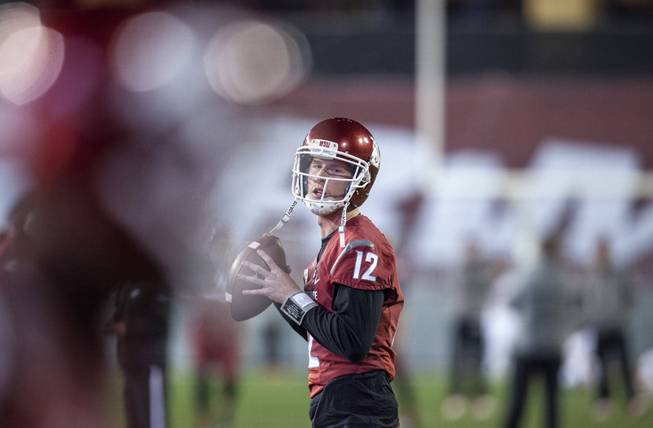 Washington State quarterback Connor Halliday (12) throws to a receiver during warmups before the start of an NCAA college football game against Oregon State on Saturday, Oct. 12, 2013, at Martin Stadium in Pullman, Wash. Oregon State won 52-24. 