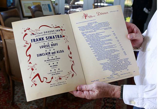 Steve Cutler holds a Desert Inn program featuring Frank Sinatra at his home Wednesday, Oct. 16, 2013. Cutler is founder of Casino Legends Hall of Fame.