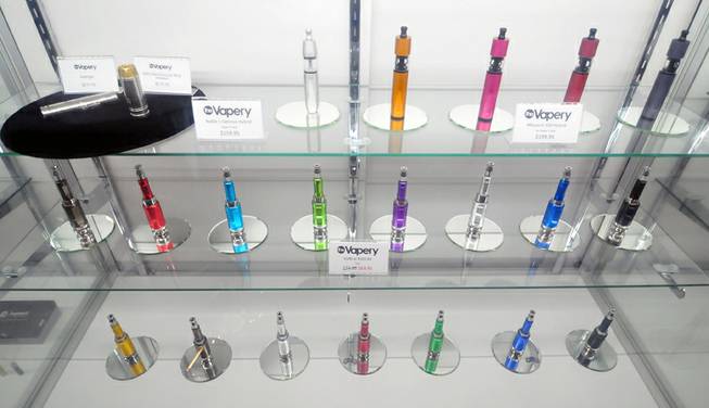 Several e-cigarettes are on display at The Vapery, a vapor shop located at 8060 S. Rainbow Road, on Friday, Oct. 11, 2013. The rise in e-cigarette use among young adults and teenagers is a growing concern among health officials, who have long waged a public health campaign against smoking.