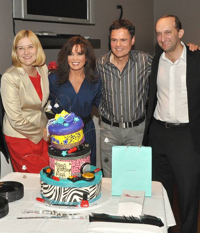 Flamingo Las Vegas Regional President Eileen Moore, Marie Osmond, Donny Osmond and and Caesars Entertainment Senior VP of Marketing and Entertainment Jason Gastwirth celebrate Marie's 54th birthday at the Flamingo on Tuesday, Oct. 15, 2013. Marie turned 54 on Sunday.