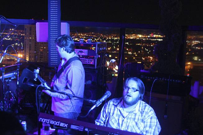 Moksha band members John Heishman, left, on bass and Brian Triola, right, during their set at the "Rooftop Fall Ball 3" on the Binion's Gambling Hall & Hotel rooftop pool deck, Friday, Oct. 18, 2013.