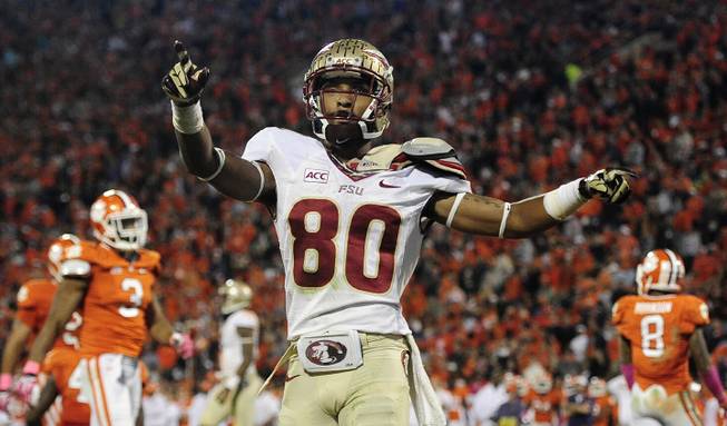 Florida State wide receiver Rashad Greene (80) celebrates after scoring a touchdown against the Clemson during the second half of an NCAA college football game, Saturday, Oct. 19, 2013, in Clemson, S.C.