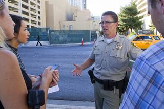 Metro Police Capt. Robert DuVall responds to questions from reporters after a Planet Hollywood employee discovered a dead baby in a trash bin outside the hotel Monday, Oct. 21, 2013.