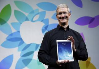 Apple CEO Tim Cook introduces the new iPad Air on Tuesday, Oct. 22, 2013, in San Francisco. 
