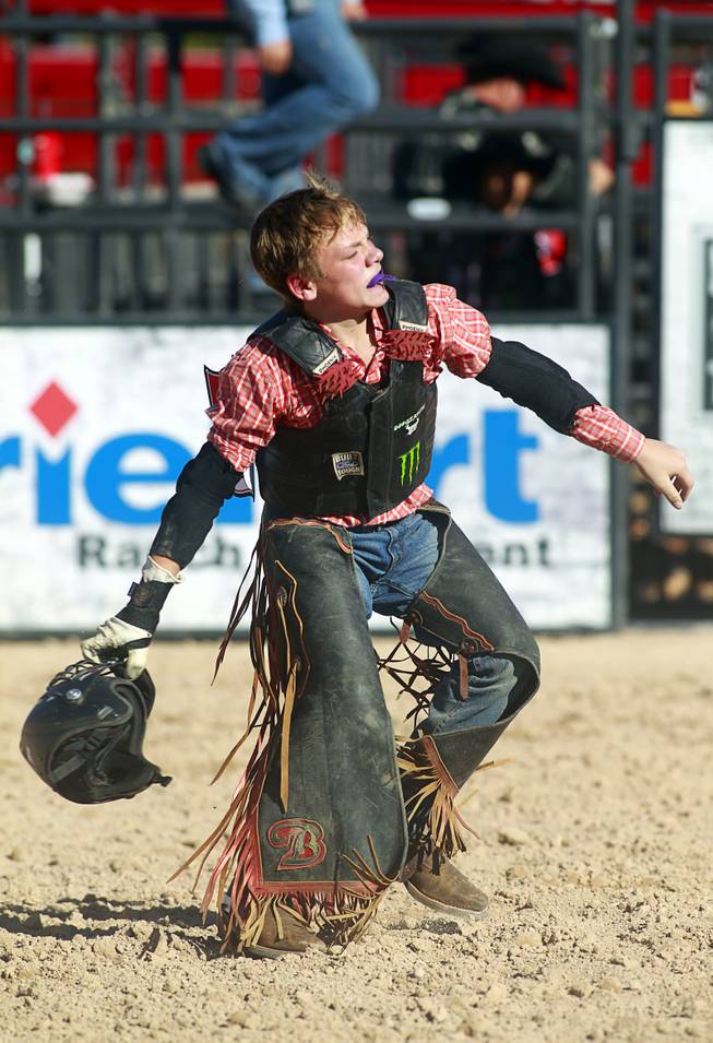 Senior rider Hunter Ray of Kolin. La. celebrates a successful ride during the Chris Shivers Miniature Bull Riding (MBR) World Finals at Mandalay Bay Thursday, Oct. 24, 2013. The MBR features junior riders ages 8 to11 and senior riders ages 12 to 14. The event was part of the the 2013 Professional Bull Riders Built Ford Tough World Finals.