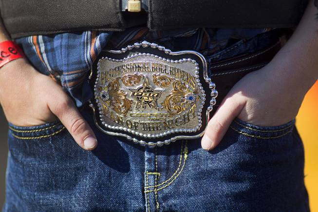 Vance Rupp, 7, of Polk City, Iowa sports a PBR belt buckle during a Mutton Bustin' competition at the Tyson Fan Zone & Marketplace at Mandalay Bay Thursday, Oct. 24, 2013. Riders must be four to seven years old and weigh 60 lbs. or less. The event was part of the the 2013 Professional Bull Riders Built Ford Tough World Finals. Rupp won the morning competition.